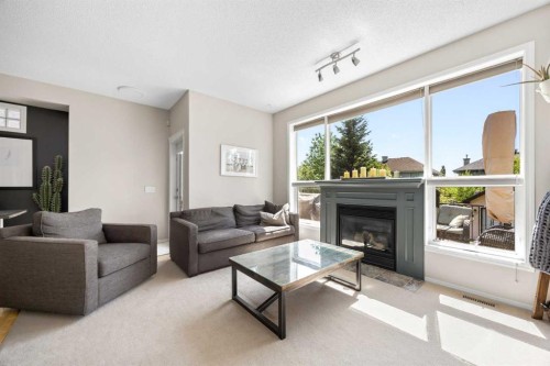 138 Cranwell Close Se, Calgary, AB - Indoor Photo Showing Living Room With Fireplace