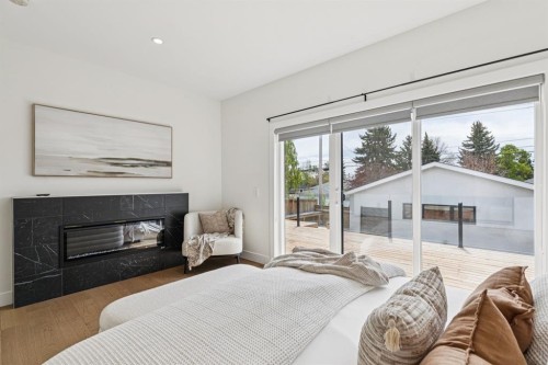 4747 26 Avenue Sw, Calgary, AB - Indoor Photo Showing Bedroom With Fireplace