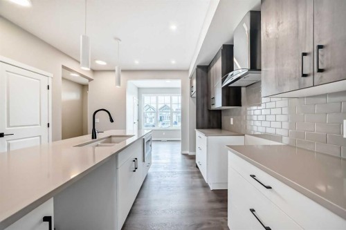 23 Magnolia Street Se, Calgary, AB - Indoor Photo Showing Kitchen With Double Sink With Upgraded Kitchen