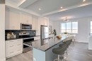 381 Waterford Boulevard, Chestermere, AB  - Indoor Photo Showing Kitchen With Double Sink With Upgraded Kitchen 
