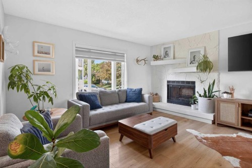48 Shawcliffe Place, Calgary, AB - Indoor Photo Showing Living Room With Fireplace