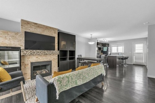 425 Copperpond Landing Se, Calgary, AB - Indoor Photo Showing Living Room With Fireplace
