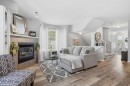 88 Chaparral Ridge Terrace Se, Calgary, AB  - Indoor Photo Showing Living Room With Fireplace 