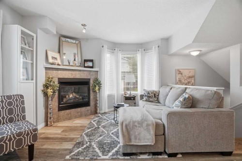 88 Chaparral Ridge Terrace Se, Calgary, AB - Indoor Photo Showing Living Room With Fireplace