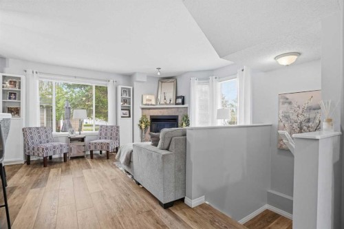 88 Chaparral Ridge Terrace Se, Calgary, AB - Indoor Photo Showing Living Room With Fireplace