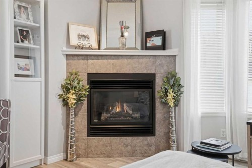88 Chaparral Ridge Terrace Se, Calgary, AB - Indoor Photo Showing Living Room With Fireplace