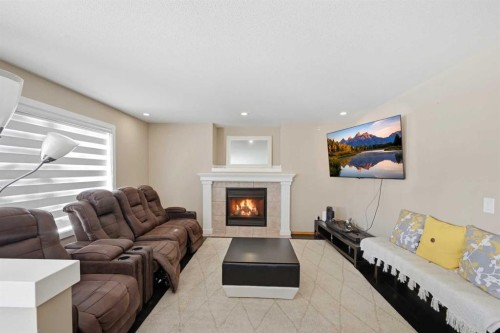 46 Panorama Hills Close Nw, Calgary, AB - Indoor Photo Showing Living Room With Fireplace