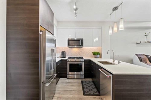 3404-95 Burma Star Road Sw, Calgary, AB - Indoor Photo Showing Kitchen With Stainless Steel Kitchen With Double Sink With Upgraded Kitchen