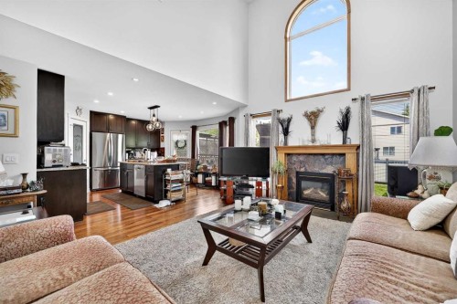 192 Arbour Wood Close Nw, Calgary, AB - Indoor Photo Showing Living Room With Fireplace
