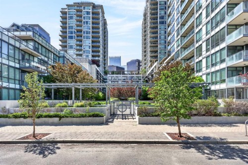 47 Waterfront Mews Sw, Calgary, AB - Outdoor With Balcony With Facade