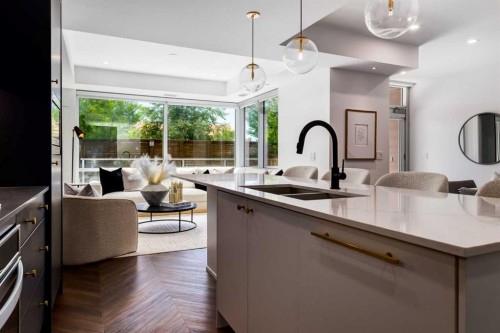 104-8445 Broadcast Avenue Sw, Calgary, AB - Indoor Photo Showing Kitchen With Double Sink