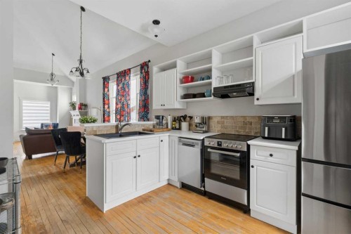 128 18 Avenue Ne, Calgary, AB - Indoor Photo Showing Kitchen With Stainless Steel Kitchen With Double Sink
