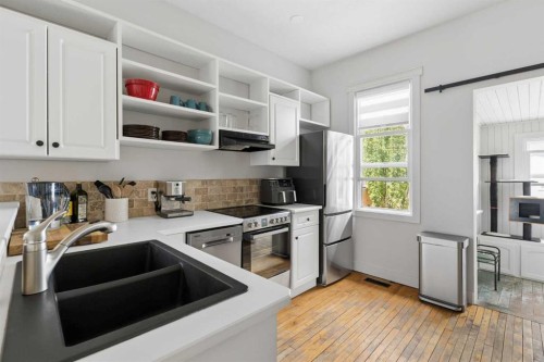 128 18 Avenue Ne, Calgary, AB - Indoor Photo Showing Kitchen With Stainless Steel Kitchen With Double Sink