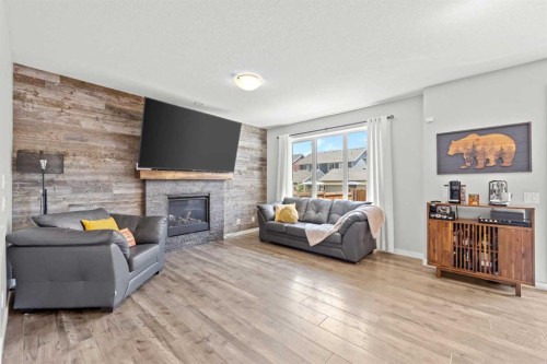 123 Masters Rise Se, Calgary, AB - Indoor Photo Showing Living Room With Fireplace