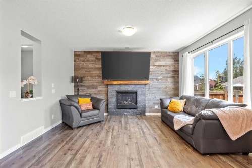 123 Masters Rise Se, Calgary, AB - Indoor Photo Showing Living Room With Fireplace