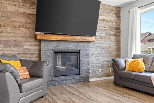 123 Masters Rise Se, Calgary, AB - Indoor Photo Showing Living Room With Fireplace