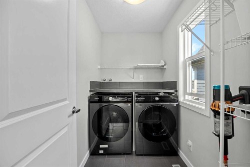 123 Masters Rise Se, Calgary, AB - Indoor Photo Showing Laundry Room