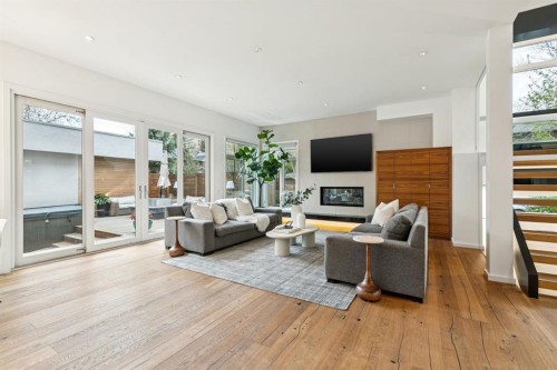 739 33A Street Nw, Calgary, AB - Indoor Photo Showing Living Room With Fireplace