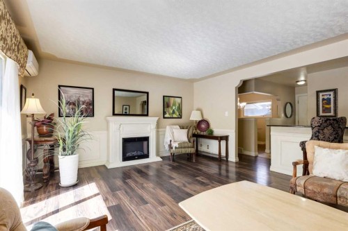 7203 5 Street Sw, Calgary, AB - Indoor Photo Showing Living Room With Fireplace