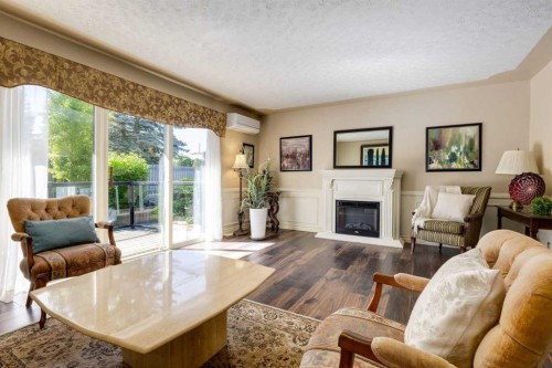 7203 5 Street Sw, Calgary, AB - Indoor Photo Showing Living Room With Fireplace