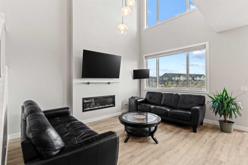 283 Belvedere Drive Se, Calgary, AB - Indoor Photo Showing Living Room With Fireplace