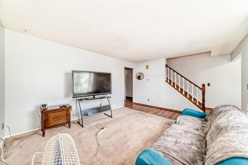 411 Abadan Place Ne, Calgary, AB - Indoor Photo Showing Living Room