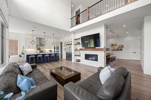 127 Kinniburgh Crescent, Chestermere, AB - Indoor Photo Showing Living Room With Fireplace