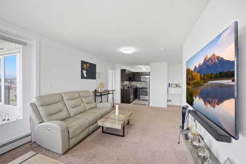 1408-6118 80 Avenue Ne, Calgary, AB - Indoor Photo Showing Living Room