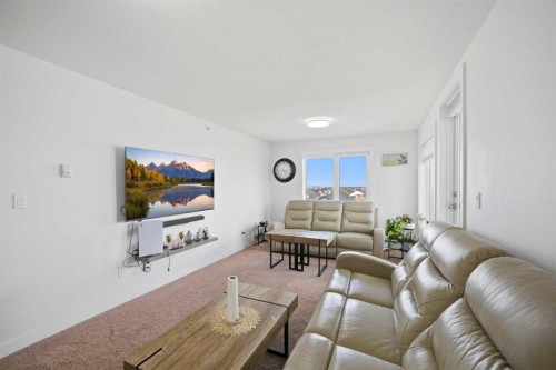 1408-6118 80 Avenue Ne, Calgary, AB - Indoor Photo Showing Living Room