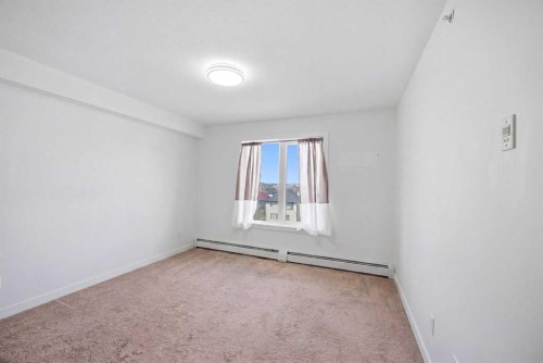 1408-6118 80 Avenue Ne, Calgary, AB - Indoor Photo Showing Other Room