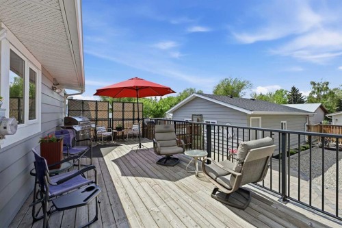 2406 26 Street, Nanton, AB - Outdoor With Deck Patio Veranda With Exterior