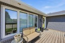 2406 26 Street, Nanton, AB  - Outdoor With Deck Patio Veranda With Exterior 