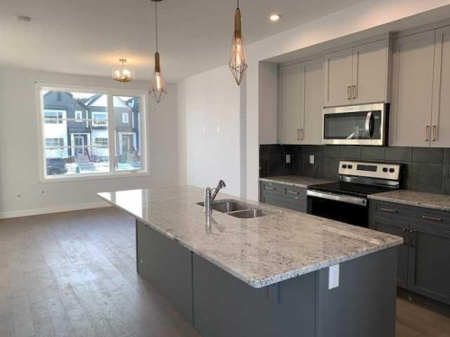 139 Ambleridge Street Nw, Calgary, AB - Indoor Photo Showing Kitchen With Double Sink With Upgraded Kitchen