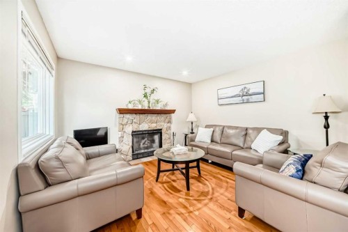232 Macewan Ridge Close Nw, Calgary, AB - Indoor Photo Showing Living Room With Fireplace