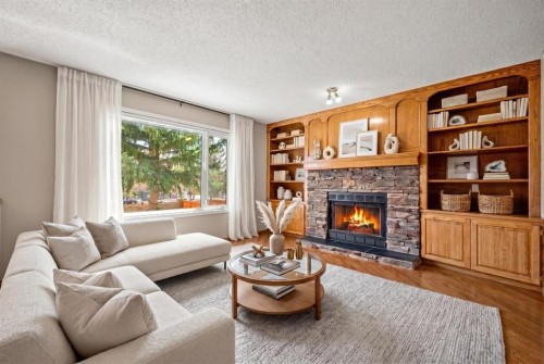 131 Lake Simcoe Court Se, Calgary, AB - Indoor Photo Showing Living Room With Fireplace
