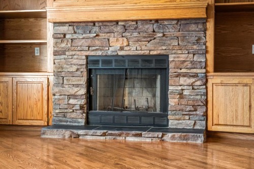 131 Lake Simcoe Court Se, Calgary, AB - Indoor With Fireplace