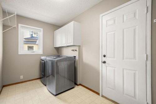 131 Lake Simcoe Court Se, Calgary, AB - Indoor Photo Showing Laundry Room