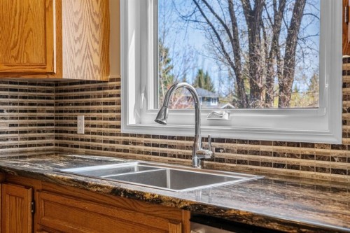 131 Lake Simcoe Court Se, Calgary, AB - Indoor Photo Showing Kitchen With Double Sink