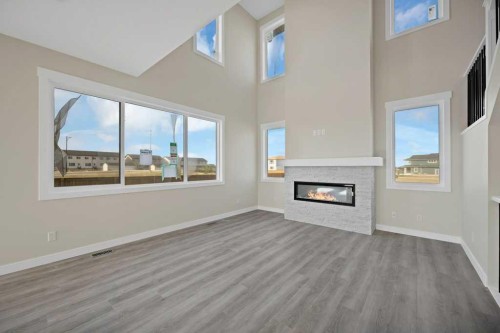 846 Chelsea Village South, Chestermere, AB - Indoor Photo Showing Other Room With Fireplace