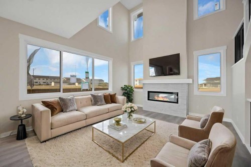846 Chelsea Village South, Chestermere, AB - Indoor Photo Showing Living Room With Fireplace