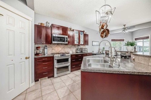 188 Chapala Drive Se, Calgary, AB - Indoor Photo Showing Kitchen With Double Sink
