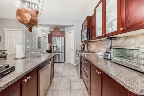 188 Chapala Drive Se, Calgary, AB - Indoor Photo Showing Kitchen With Double Sink