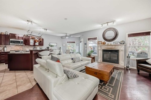 188 Chapala Drive Se, Calgary, AB - Indoor Photo Showing Living Room With Fireplace