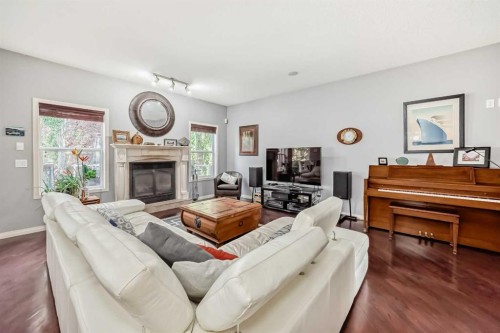 188 Chapala Drive Se, Calgary, AB - Indoor Photo Showing Living Room With Fireplace
