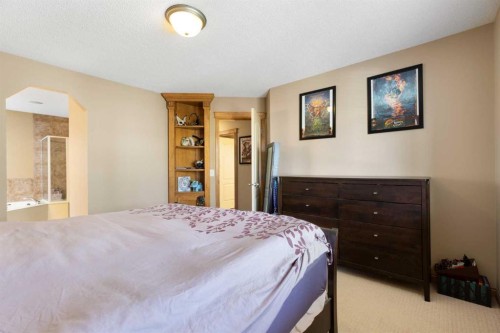 34 Tuscany Meadows Drive Nw, Calgary, AB - Indoor Photo Showing Bedroom