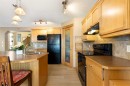 34 Tuscany Meadows Drive Nw, Calgary, AB  - Indoor Photo Showing Kitchen With Double Sink 