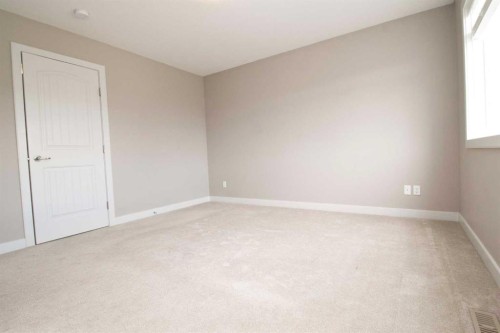 3 Sunrise Heights, Cochrane, AB - Indoor Photo Showing Other Room