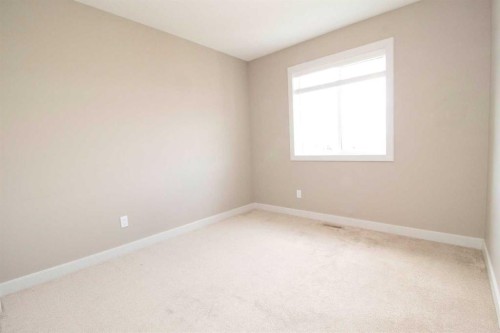 3 Sunrise Heights, Cochrane, AB - Indoor Photo Showing Other Room