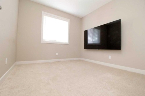3 Sunrise Heights, Cochrane, AB - Indoor Photo Showing Other Room