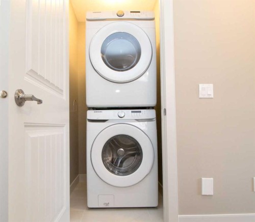 3 Sunrise Heights, Cochrane, AB - Indoor Photo Showing Laundry Room